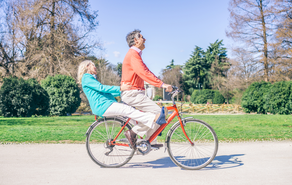 Middle aged couple on a bike